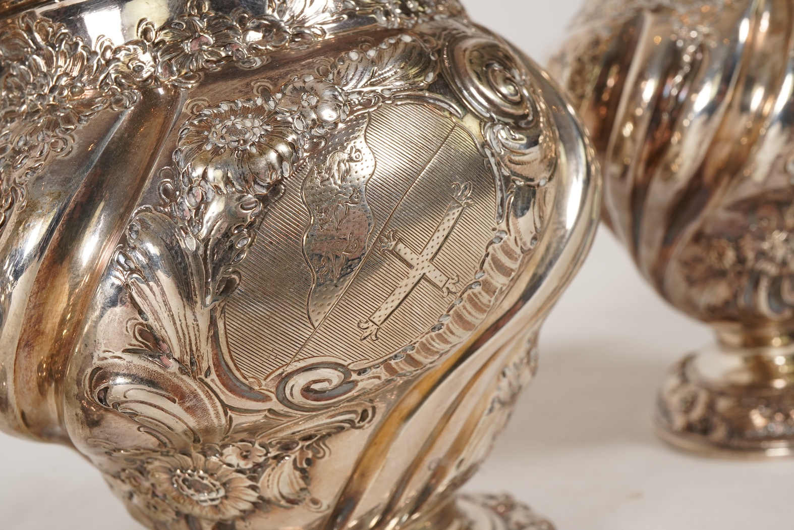 A pair of George II silver tea caddies and matching sugar box with covers, by Samuel Taylor
